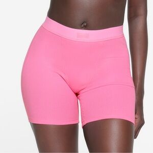 New with tags and in original bag Skims cotton rib boxer color pink, size medium